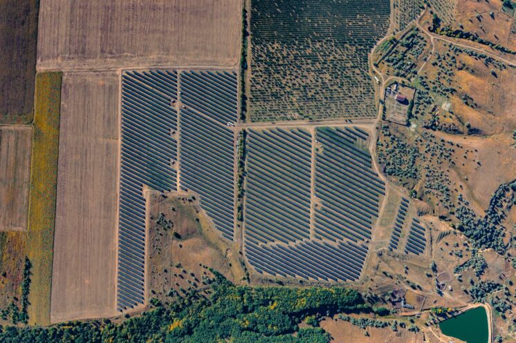 Aerial view of a large solar panel farm.