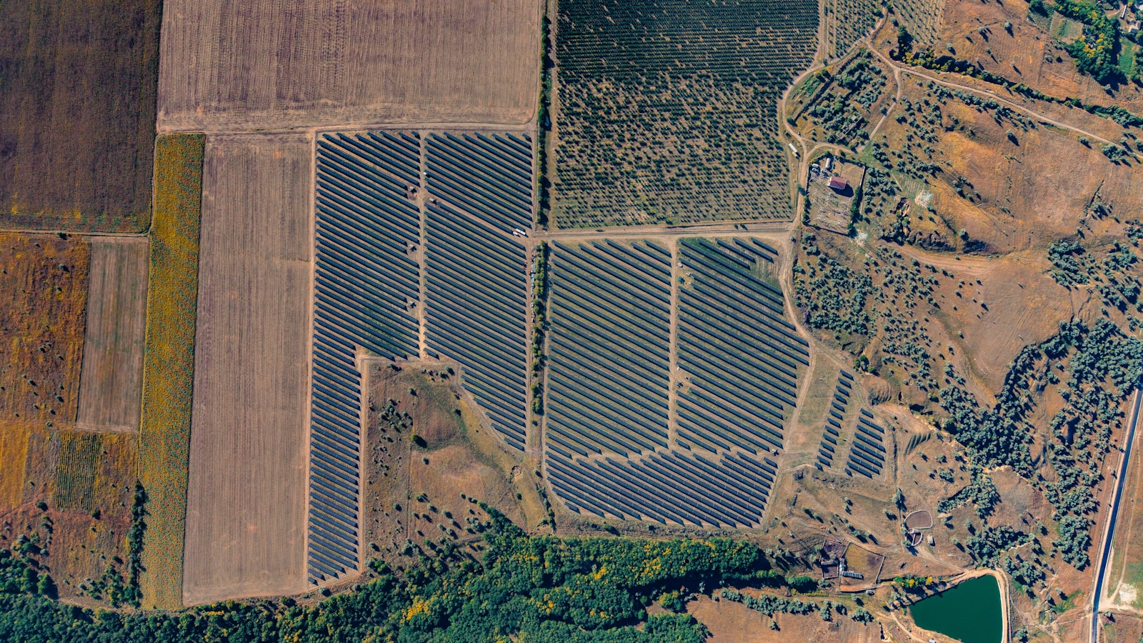 Aerial view of a large solar panel farm.
